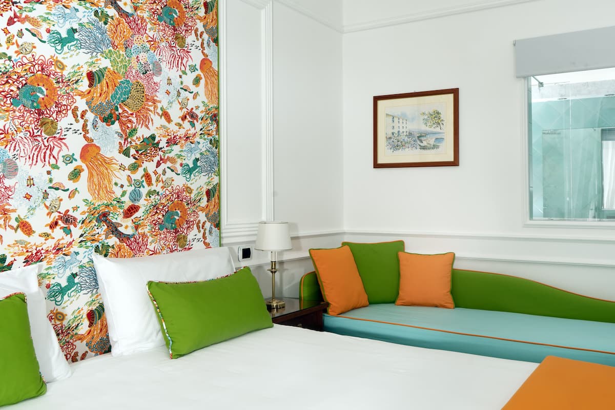 Classic Triple Room, Balcony, Sea View | Minibar, in-room safe, desk, soundproofing