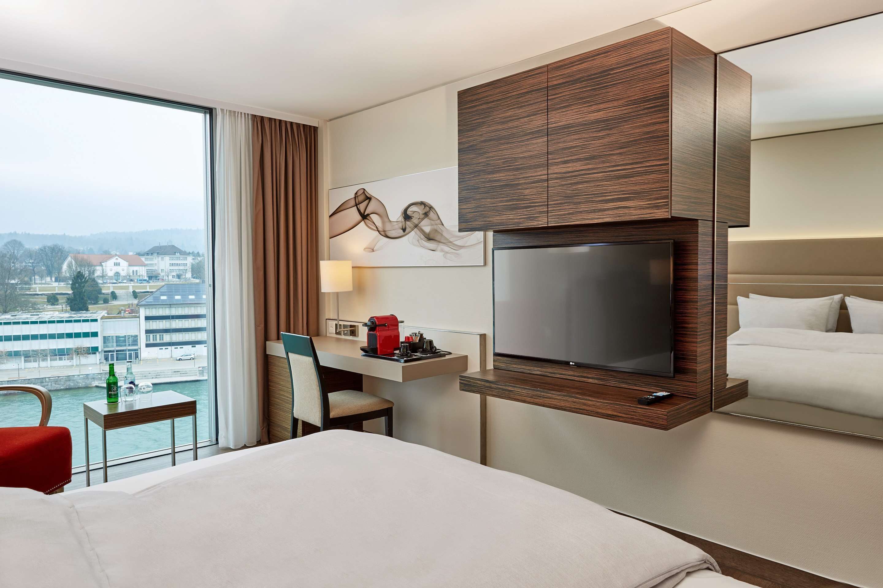 deluxe double room | in-room safe, desk, laptop workspace, blackout curtains