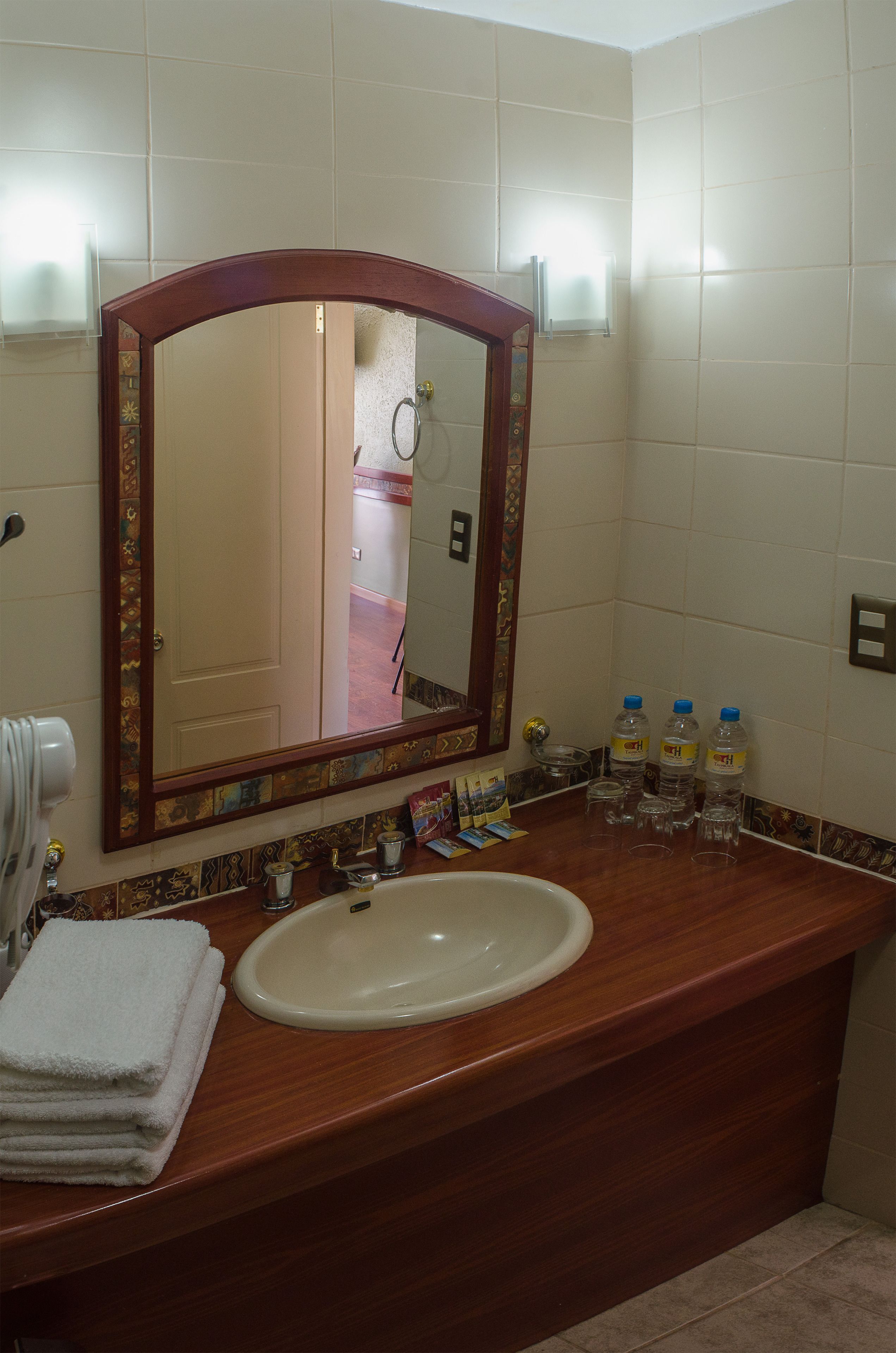 designer toiletries, hair dryer, towels