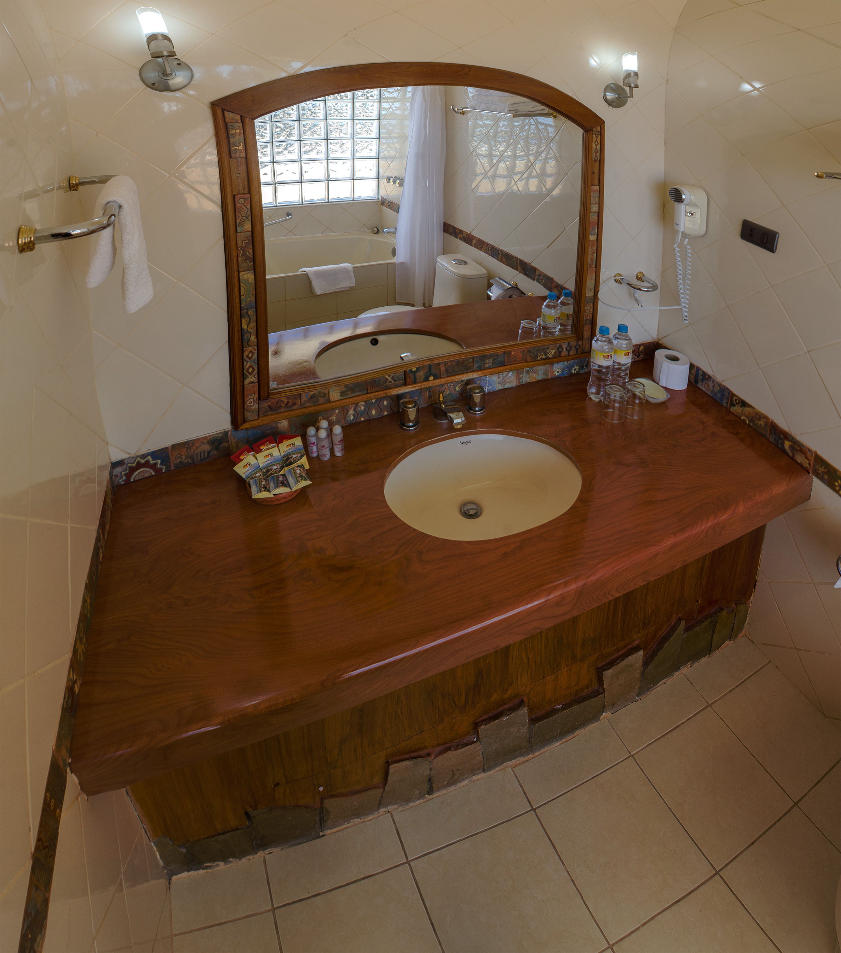 designer toiletries, hair dryer, towels