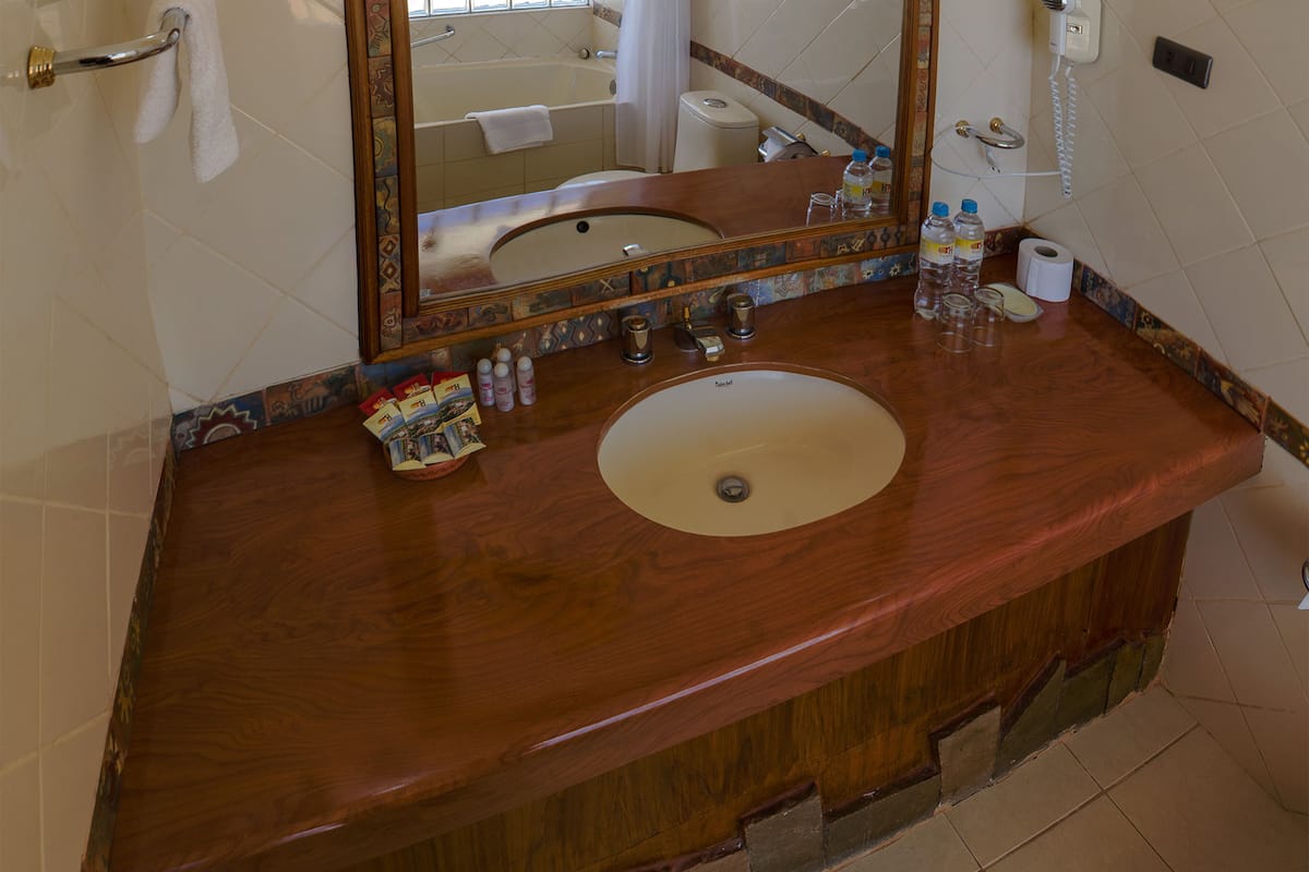 designer toiletries, hair dryer, towels