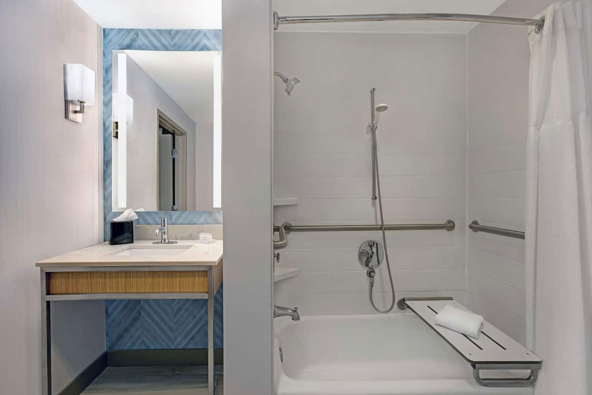 Bathroom | Designer toiletries, hair dryer, towels, shampoo