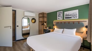Premium bedding, desk, laptop workspace, blackout drapes