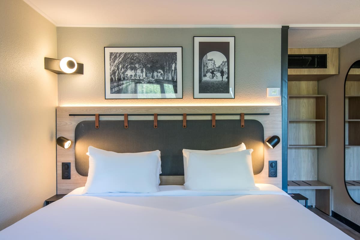 Premium bedding, desk, laptop workspace, blackout curtains