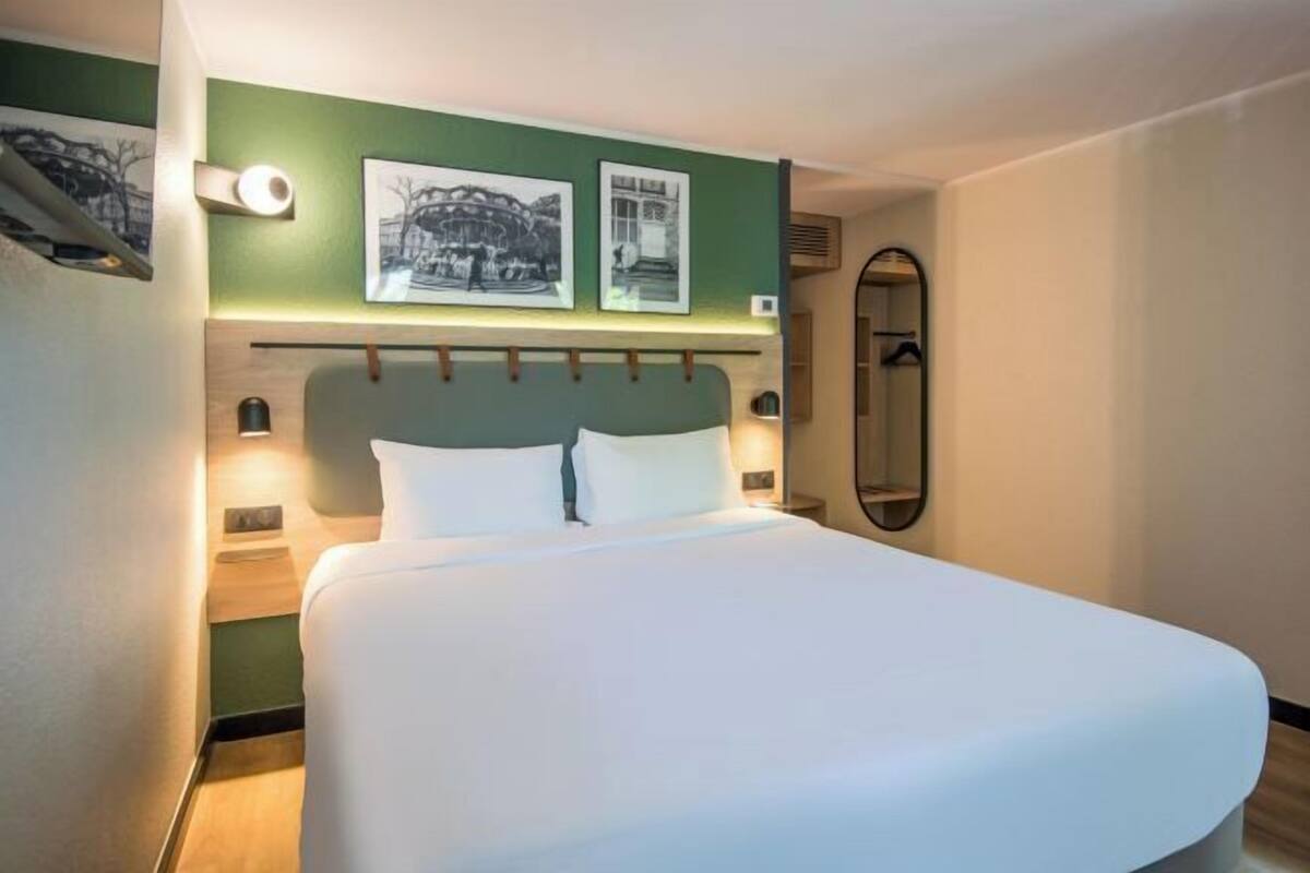 Premium bedding, desk, laptop workspace, blackout drapes