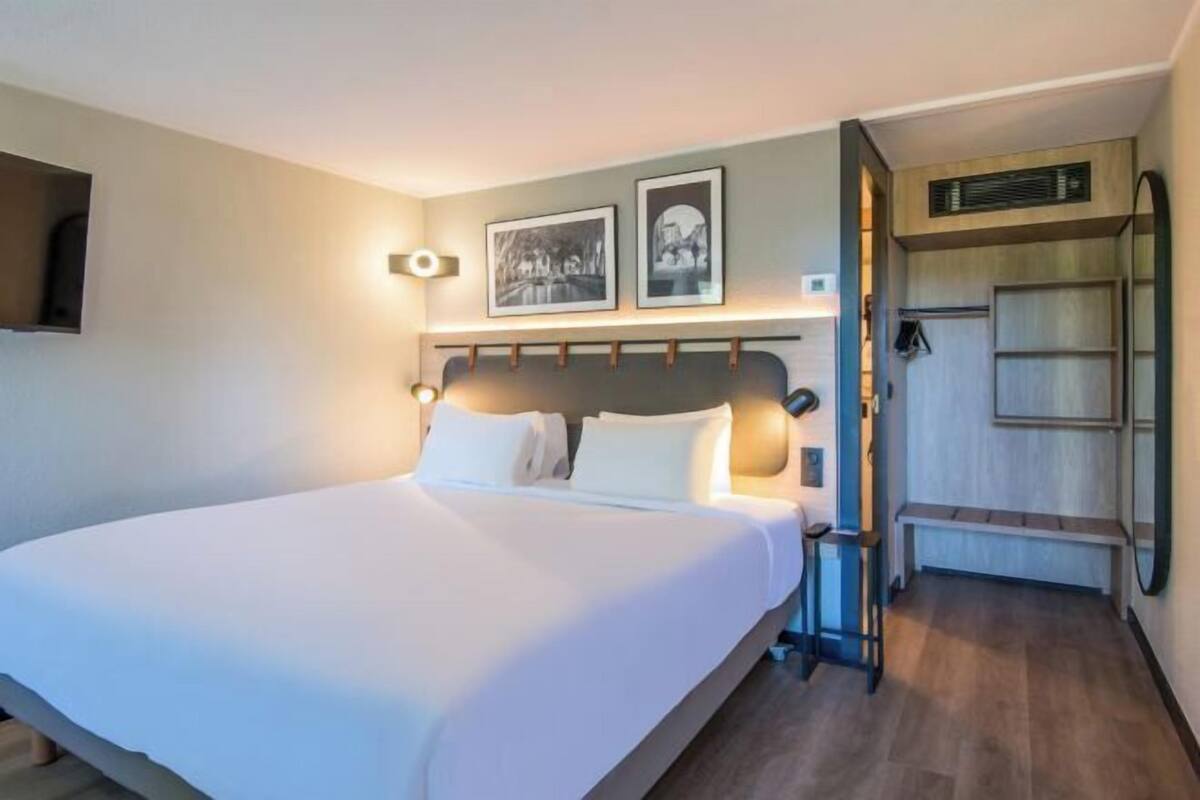 Premium bedding, desk, laptop workspace, blackout drapes