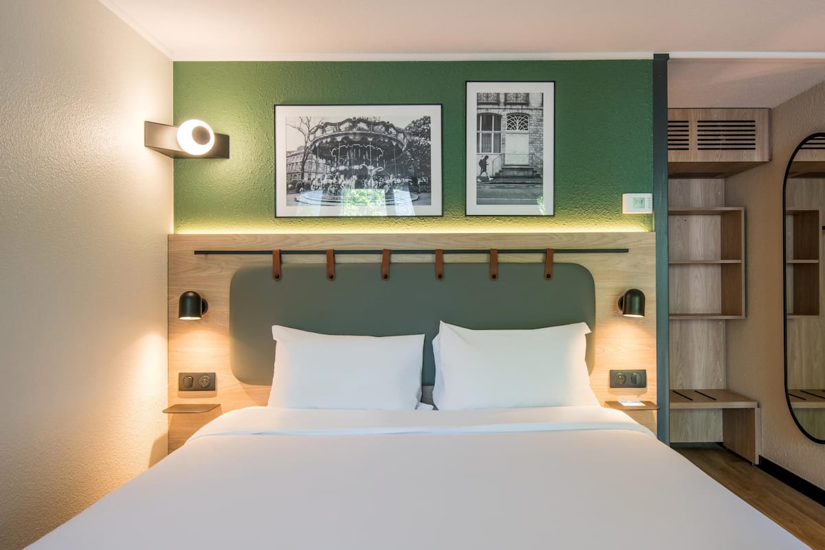 Premium bedding, desk, laptop workspace, blackout curtains