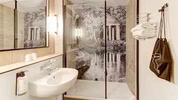 Bathtub, eco-friendly toiletries, hair dryer, towels