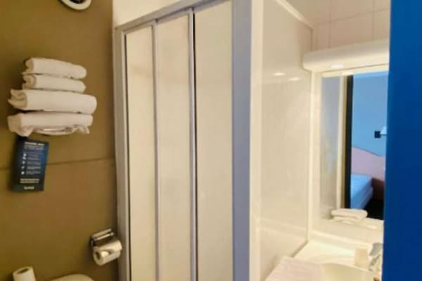 Shower, rainfall showerhead, eco-friendly toiletries, hair dryer
