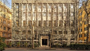 A large, historic building with a symmetrical facade, multiple windows, and a central entrance. - Melia Genova (Genoa)
