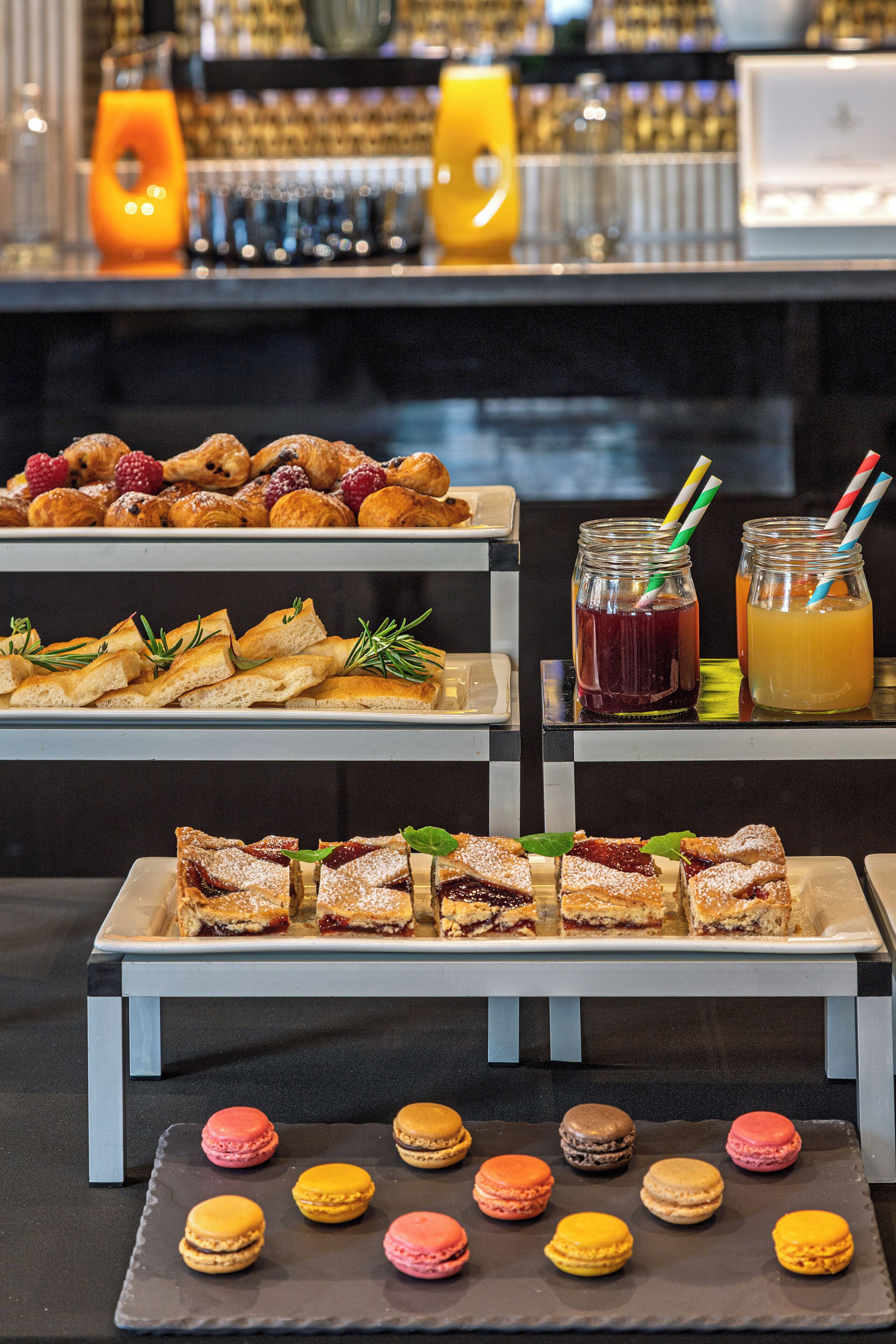 A buffet with various food items and drinks.
