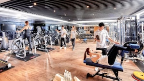 A gym with treadmills, weight machines, and a mirror wall. - Howard Prince Hotel Taichung (Taichung)