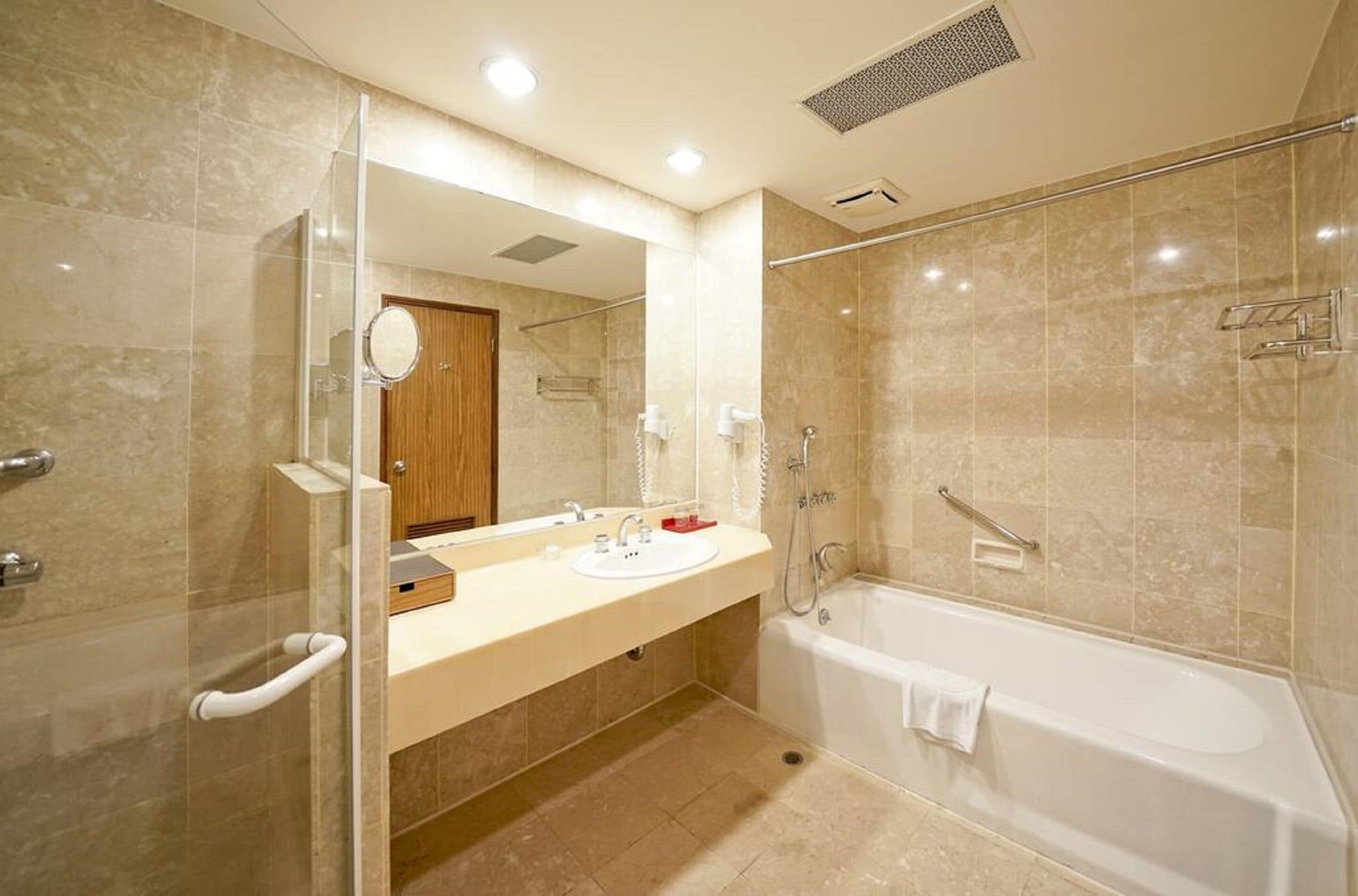 deluxe suite | bathroom | separate bathtub and shower, deep-soaking bathtub, hair dryer, slippers