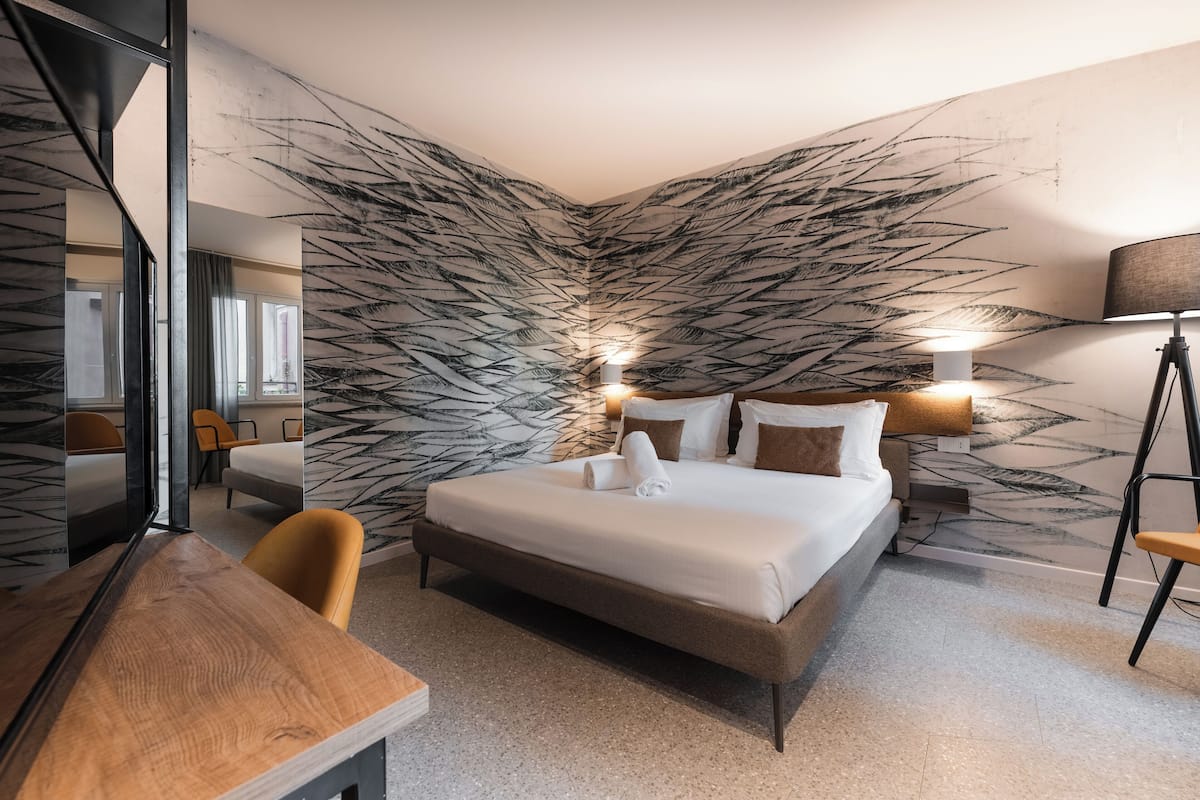 Family Suite | 2 bedrooms, down comforters, minibar, in-room safe