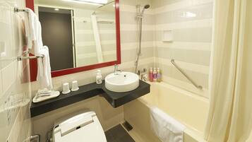 Combined shower/tub, free toiletries, hair dryer, slippers