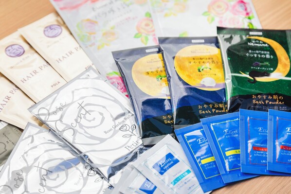 A variety of packaged products, including hair care items and bath powders, arranged on a wooden surface. - Sotetsu Fresa Inn Tokyo-Akasaka (Tokyo)