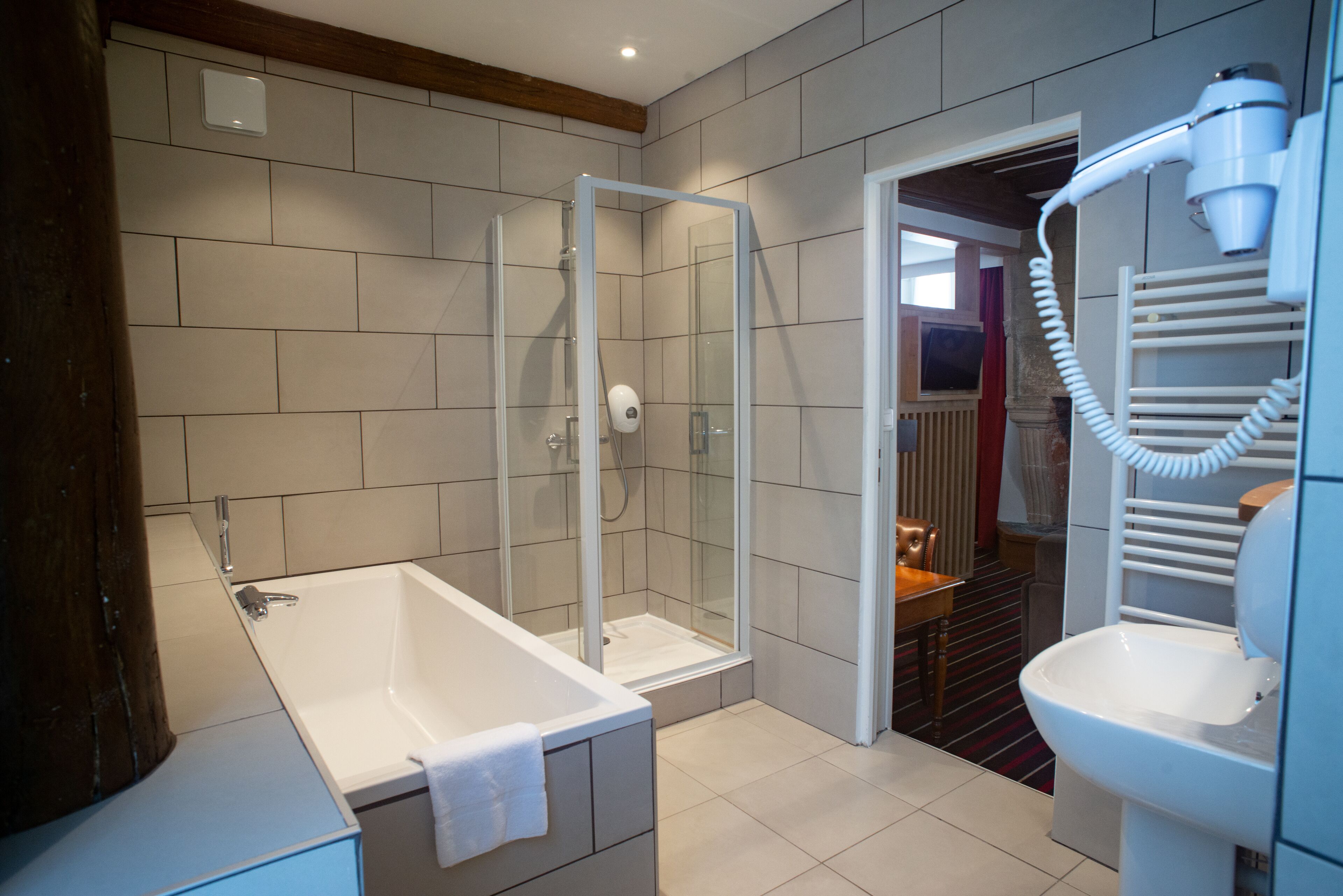 superior quadruple room - castle view | bathroom | free toiletries, hair dryer, towels, soap