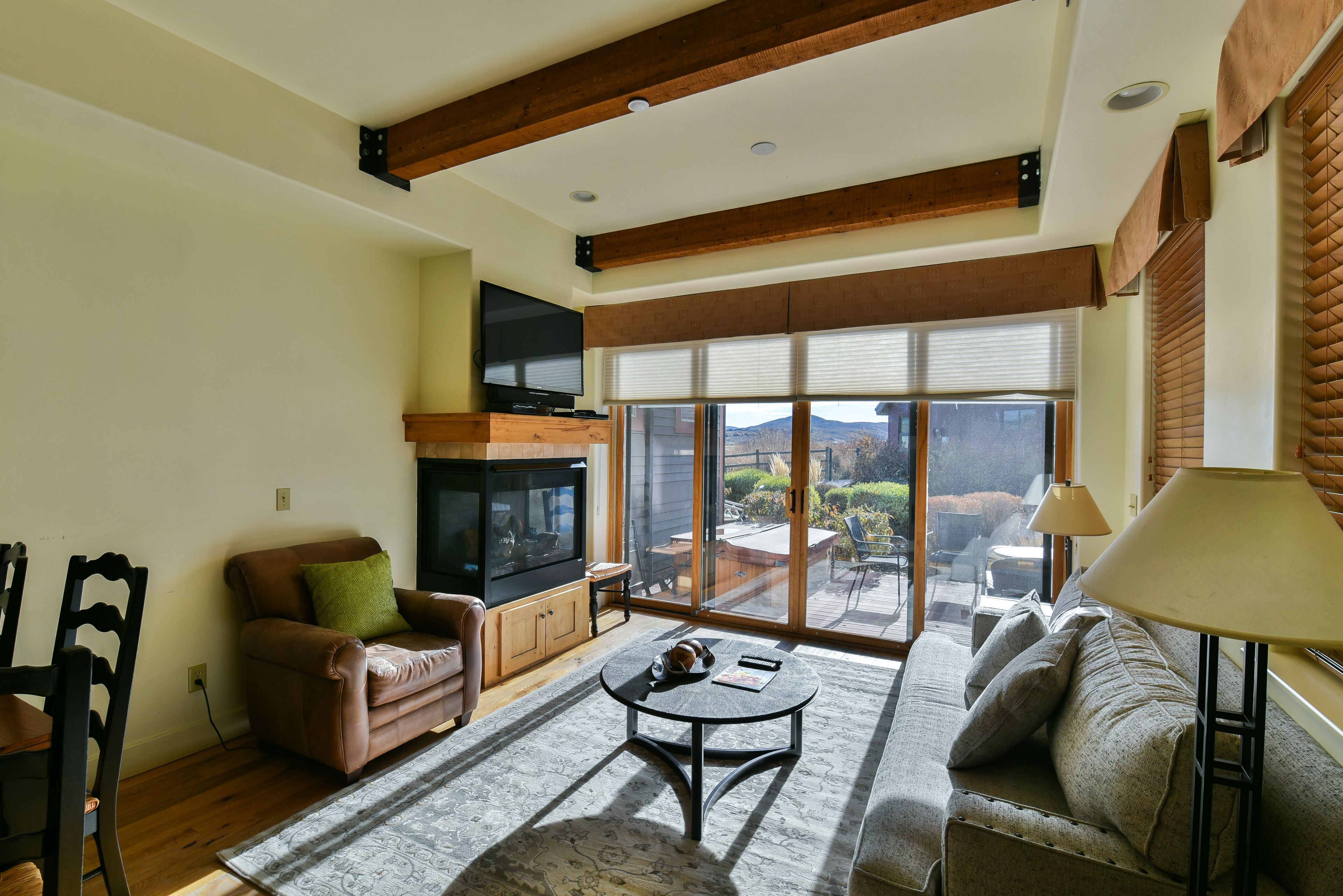 townhome, multiple beds, hot tub, mountain view | living area | fireplace