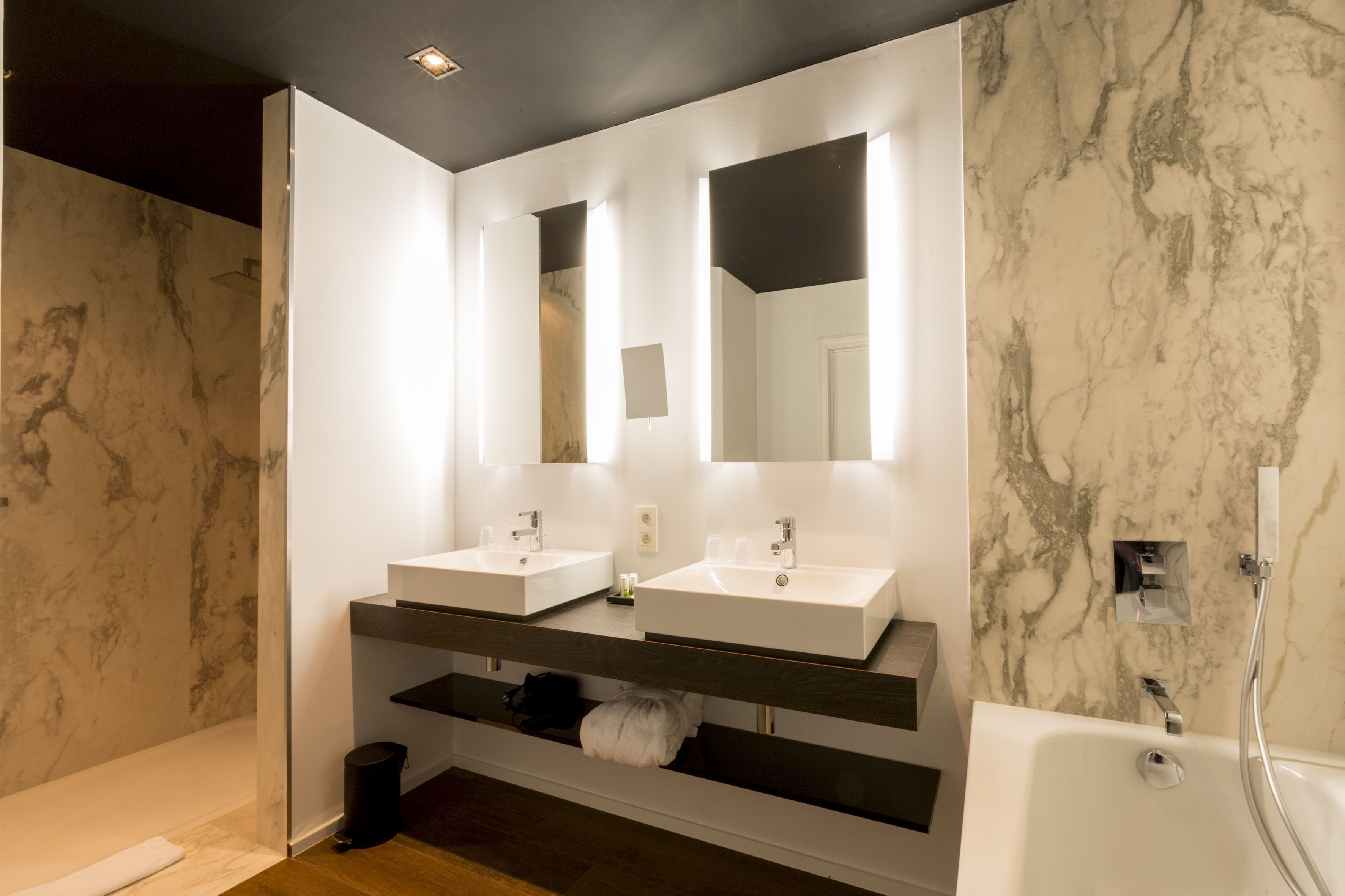 deep-soaking bathtub, eco-friendly toiletries, hair dryer, towels