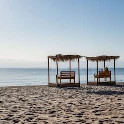 On the beach, beach umbrellas, beach towels, beach massages