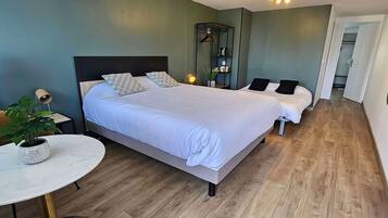 Family Room, Multiple Beds | Premium bedding, desk, laptop workspace, blackout drapes