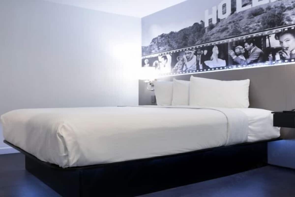Premium bedding, desk, laptop workspace, iron/ironing board