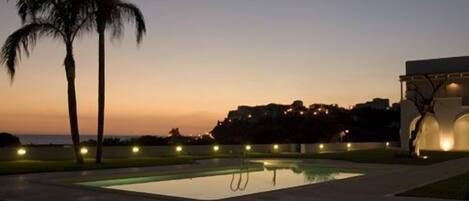 Seasonal outdoor pool, pool umbrellas, pool loungers