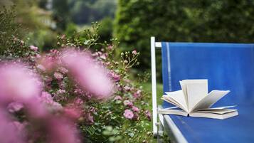 A blue chair with an open book.
