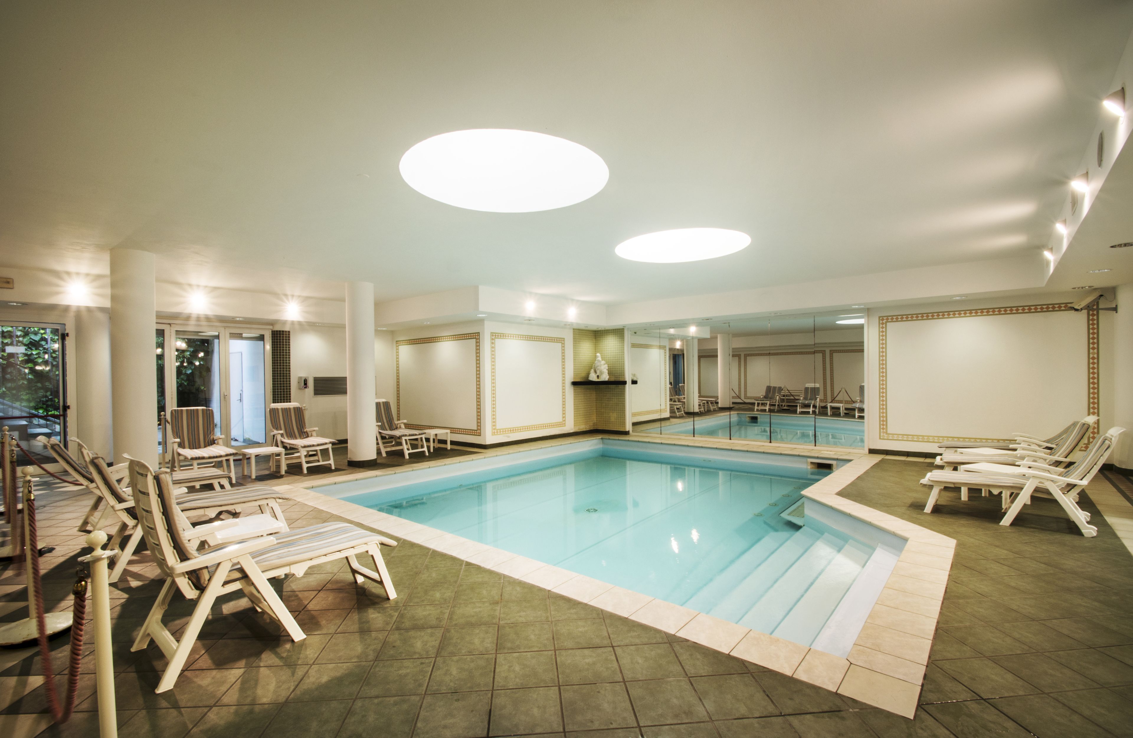 indoor pool, seasonal outdoor pool, pool loungers