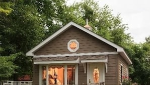 A small, single-story building with a gabled roof and a stone foundation. - Andon-Reid Inn B&B (Waynesville)