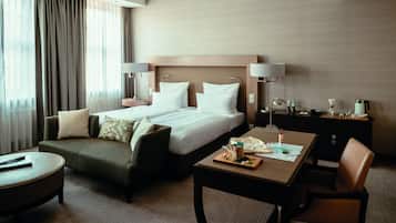 Luxe beddengoed, een minibar, een kluis op de kamer, een bureau