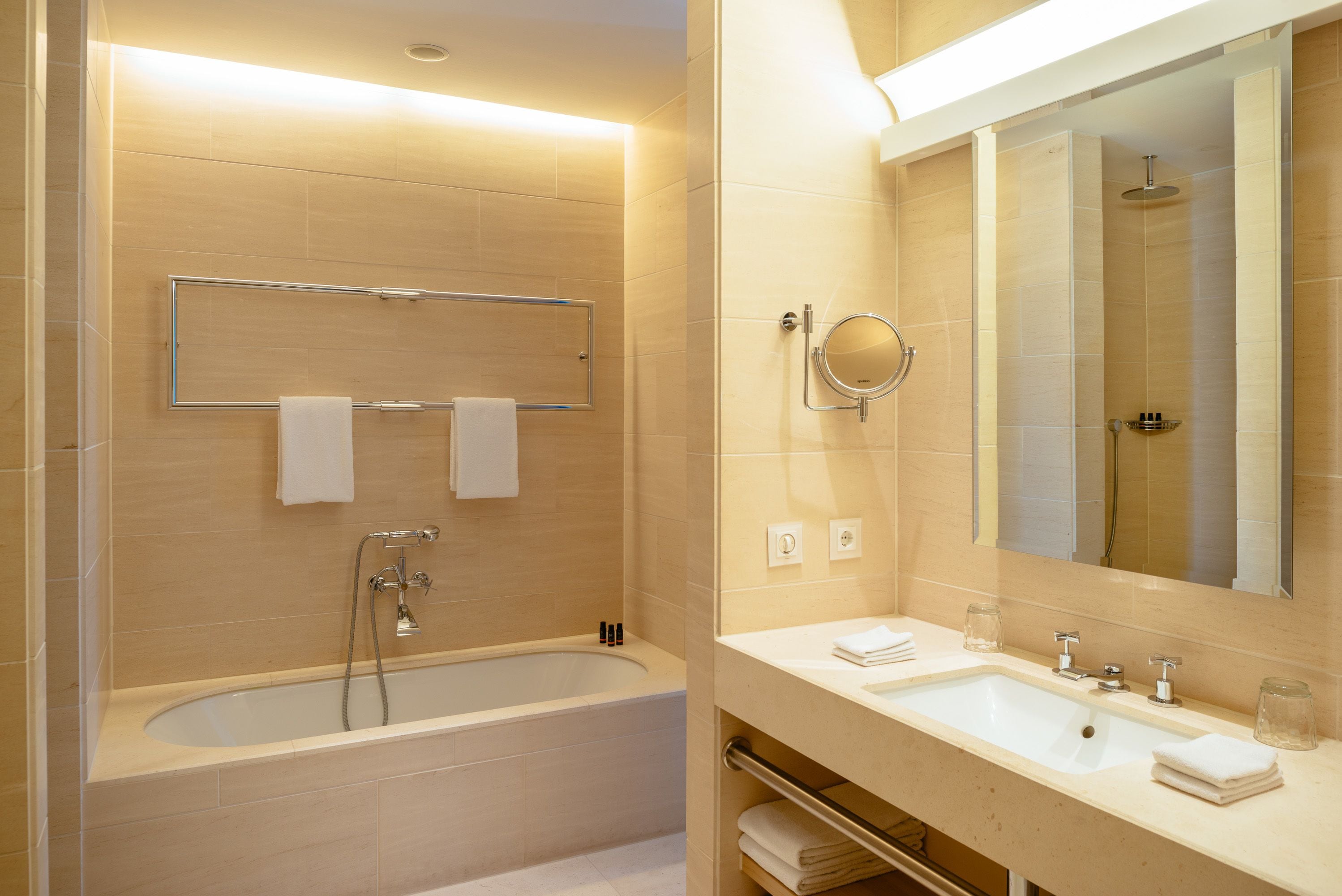 deep-soaking bathtub, rainfall showerhead, free toiletries, hair dryer