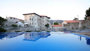 Seasonal outdoor pool, pool umbrellas, sun loungers