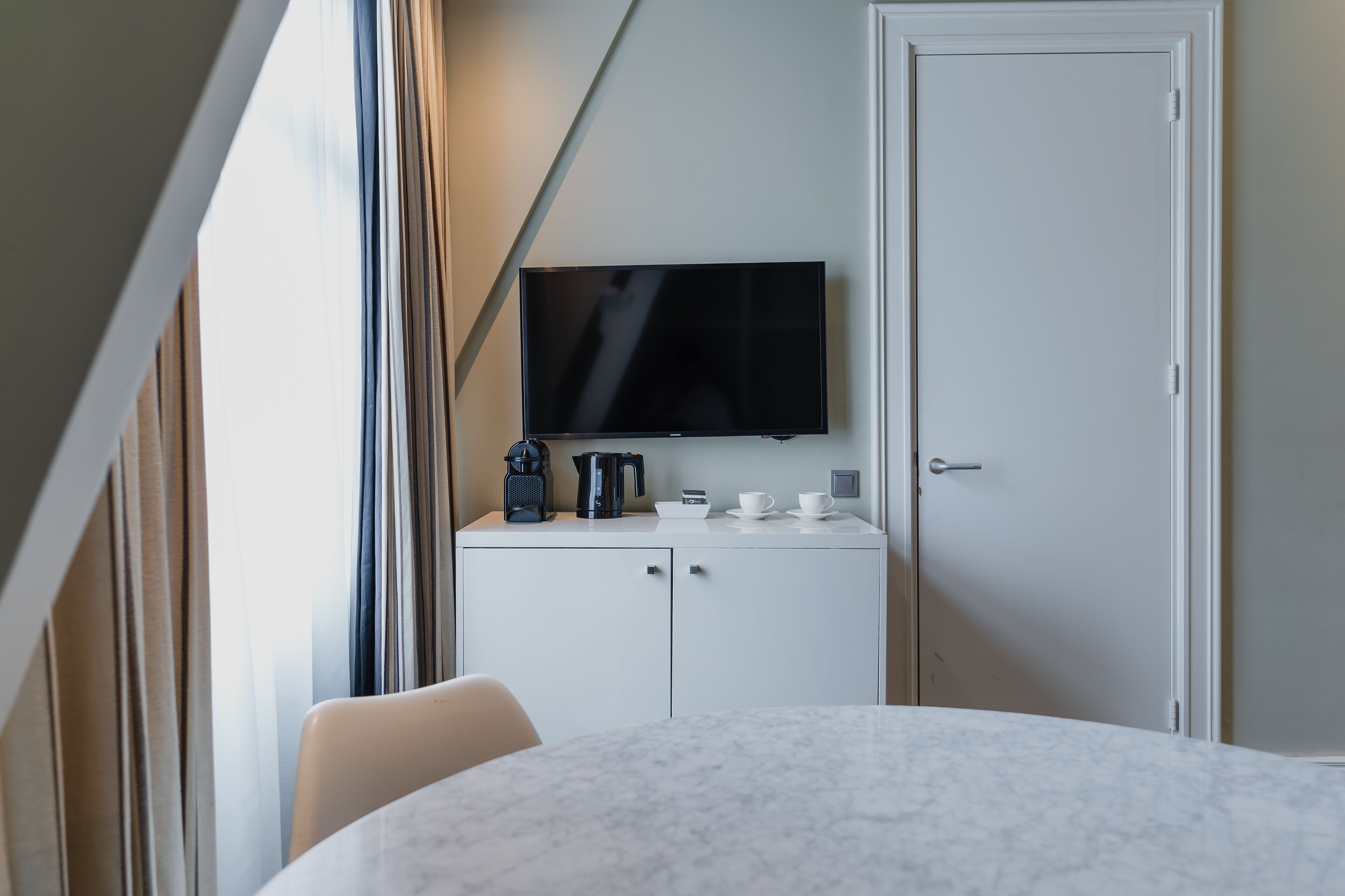 junior suite, 1 king bed | living area | flat-screen tv