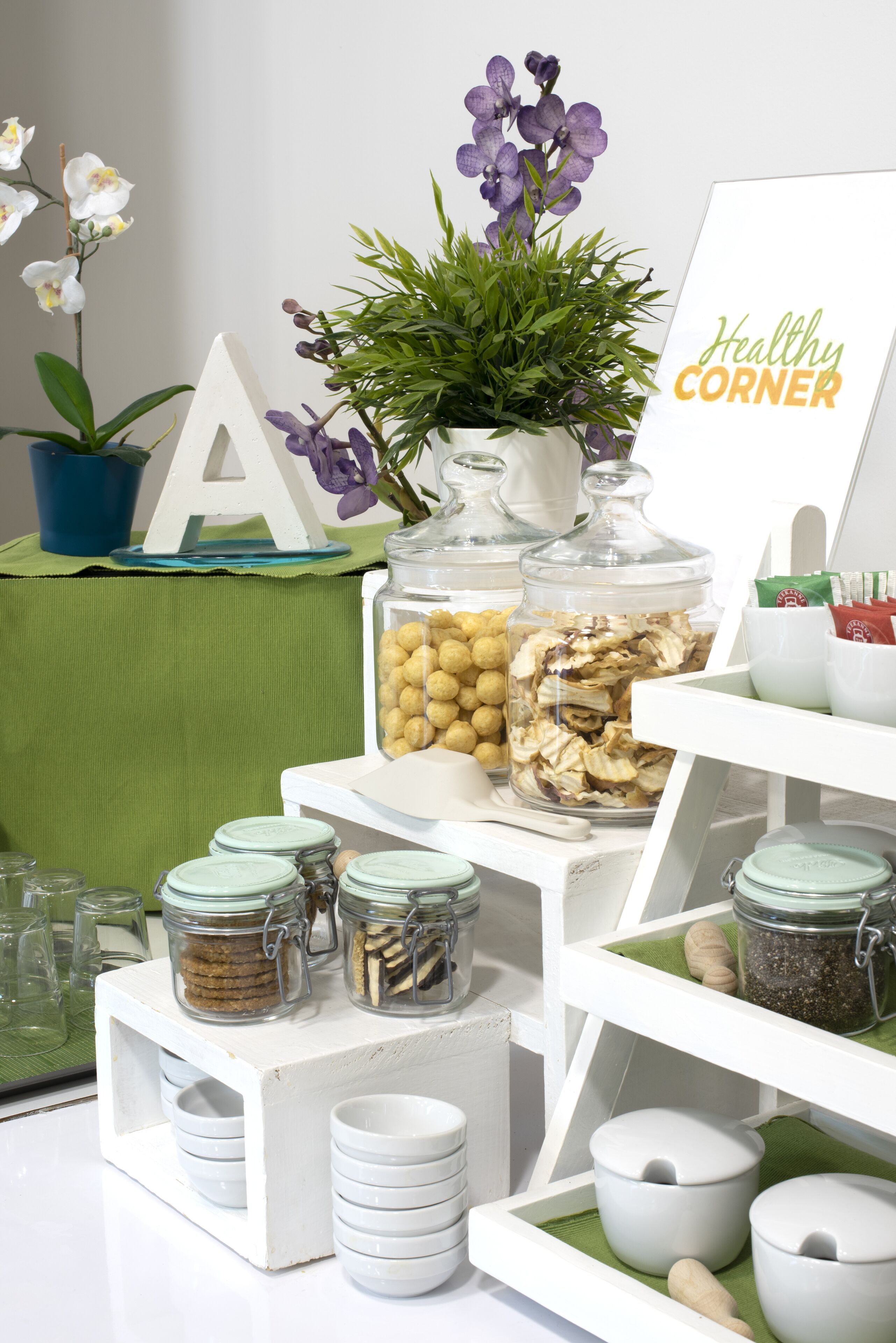 A breakfast buffet setup with various food items and decorative elements.