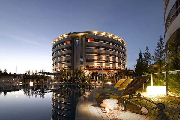 Seasonal outdoor pool, open 11:00 AM to 9:00 PM, pool umbrellas