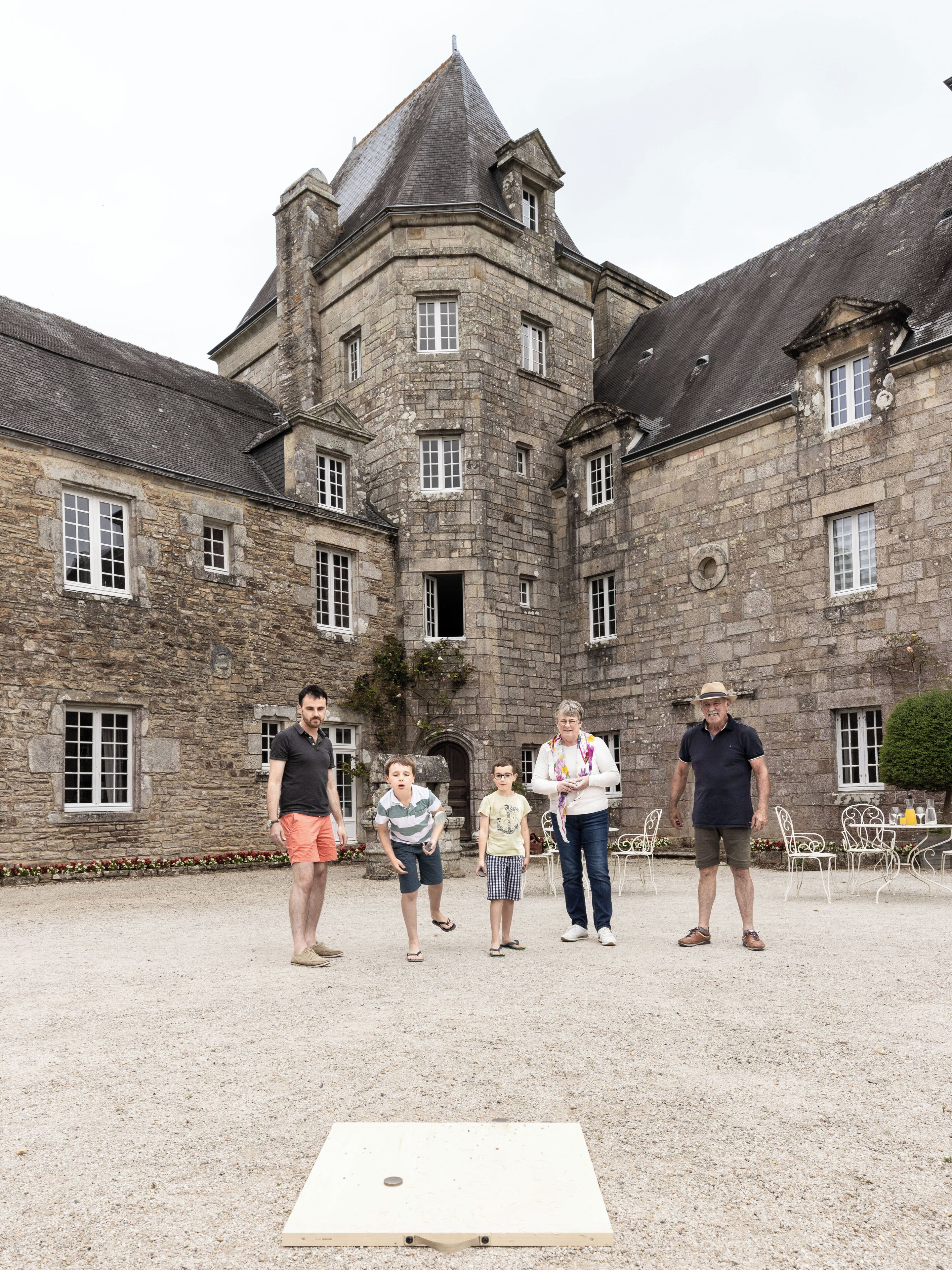 A historic stone building with a courtyard.