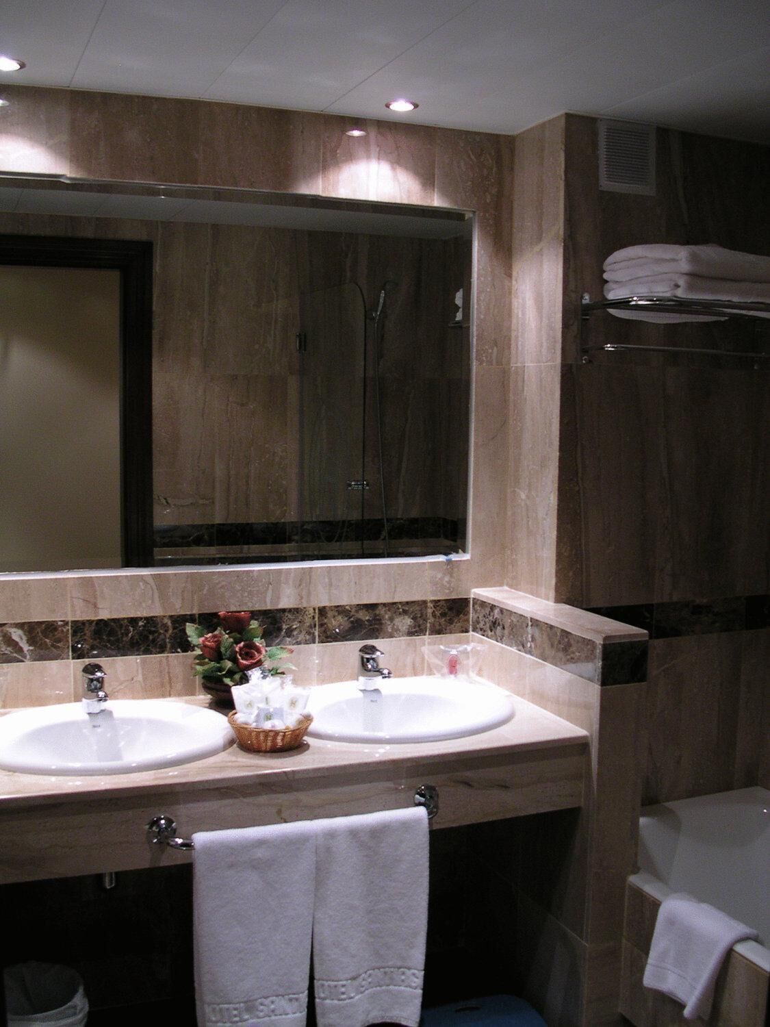 bathtub, hair dryer, towels