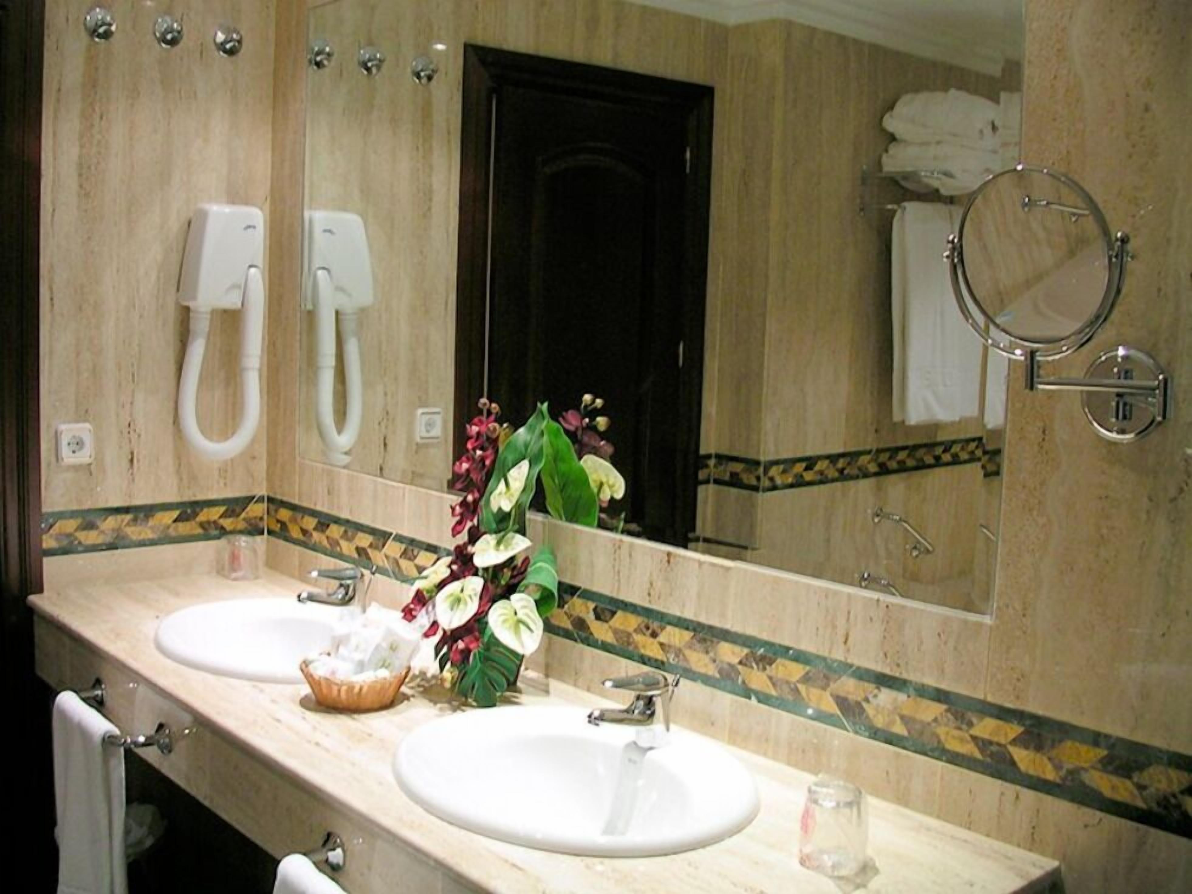 bathtub, hair dryer, towels