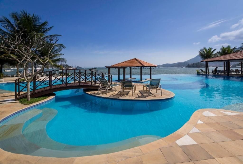 indoor pool, outdoor pool, pool umbrellas, pool loungers