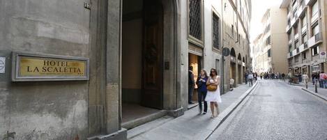 A historic building with a sign for Hotel La Scalatta.