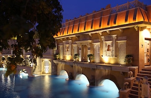 Outdoor pool, pool loungers -  Ajit Bhawan - A Palace Resort (Jodhpur)