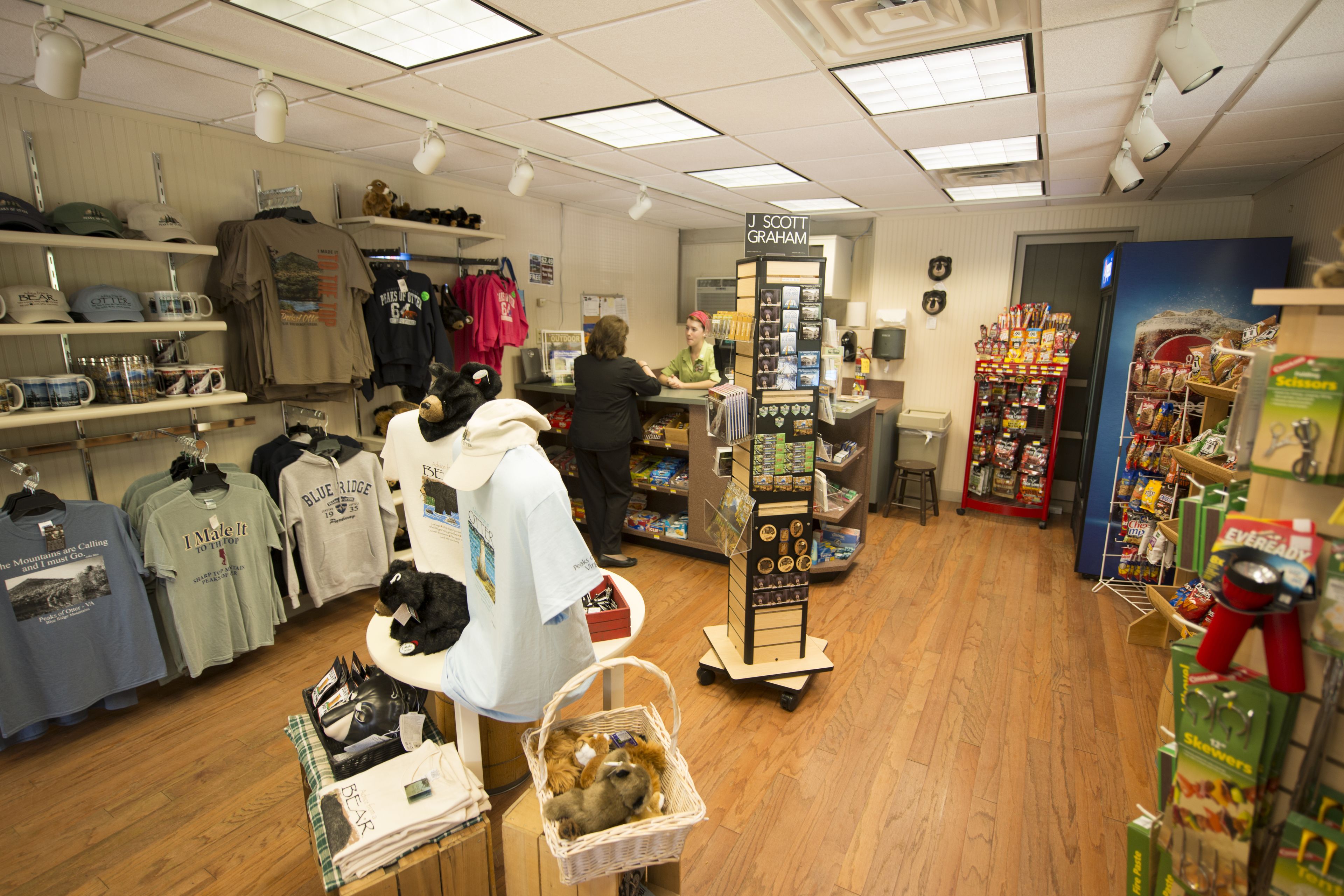A retail store with various merchandise including clothing and snacks.