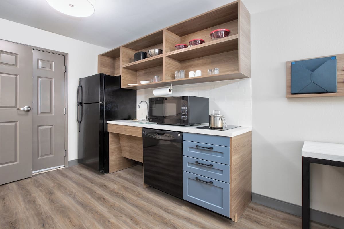 Studio Suite, 2 Double Beds | In-room safe, desk, laptop workspace, iron/ironing board