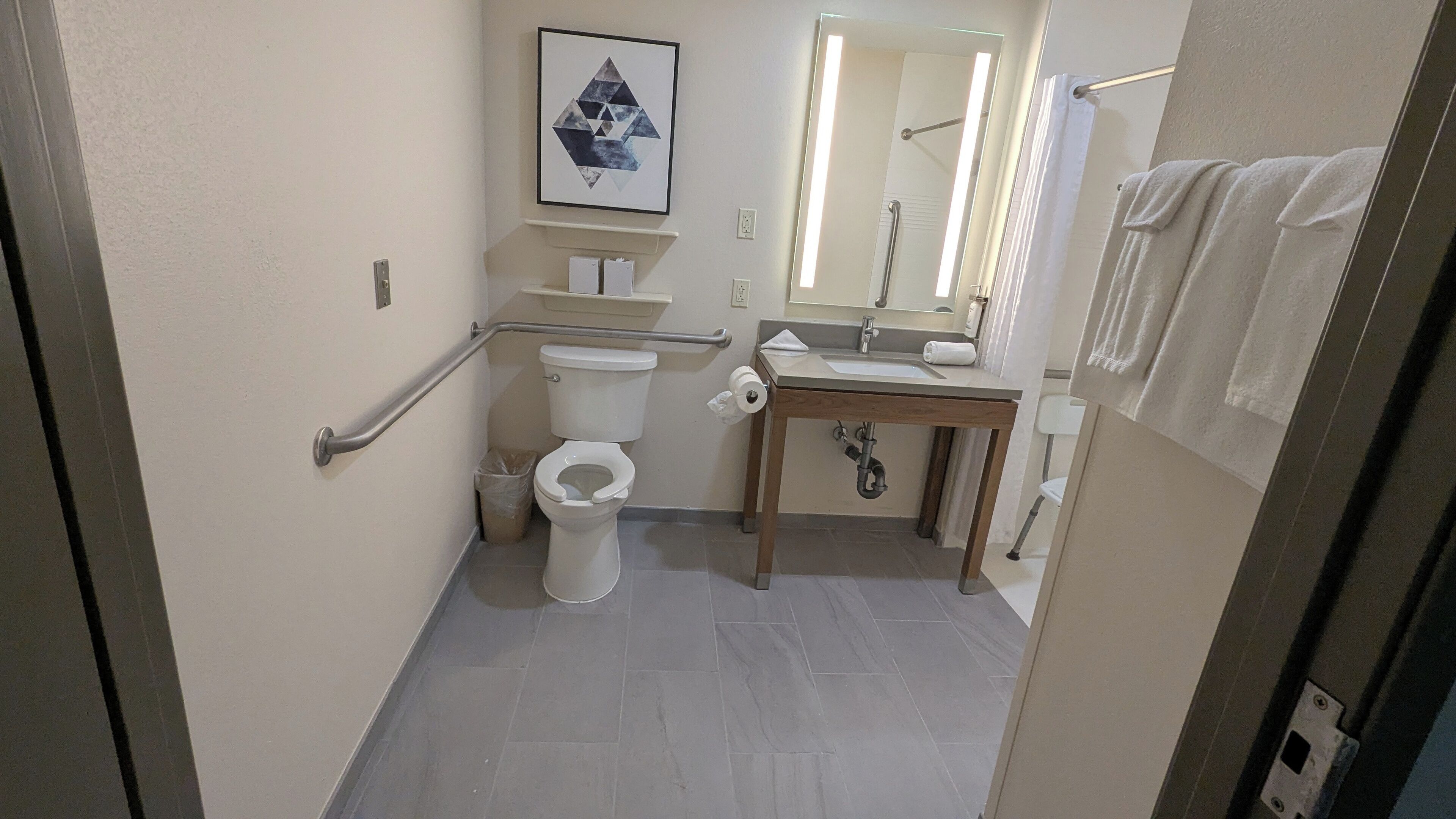 combined shower/bathtub, hair dryer, towels, soap