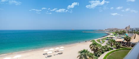 Private beach, white sand, sun loungers, beach umbrellas