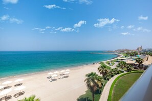 Private beach, white sand, sun loungers, beach umbrellas - Radisson Blu Resort, Fujairah (Dibba)