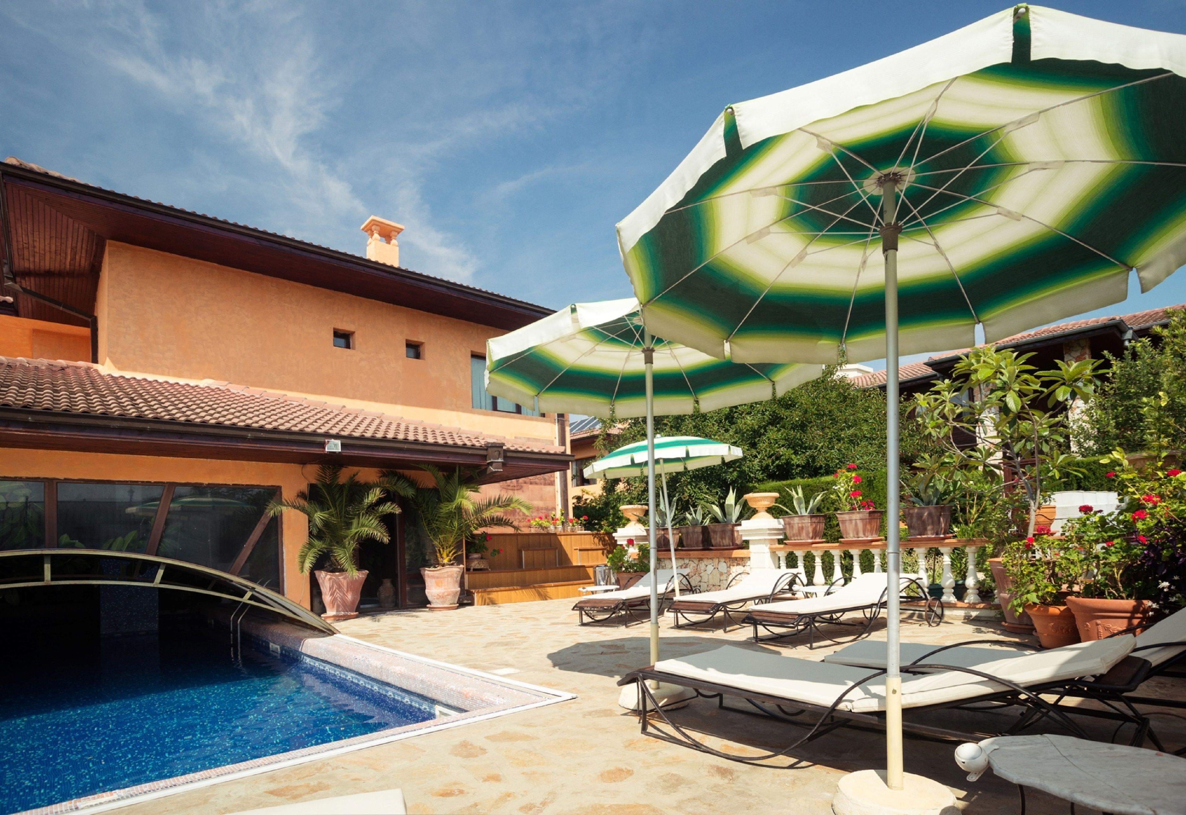 seasonal outdoor pool, pool umbrellas, pool loungers