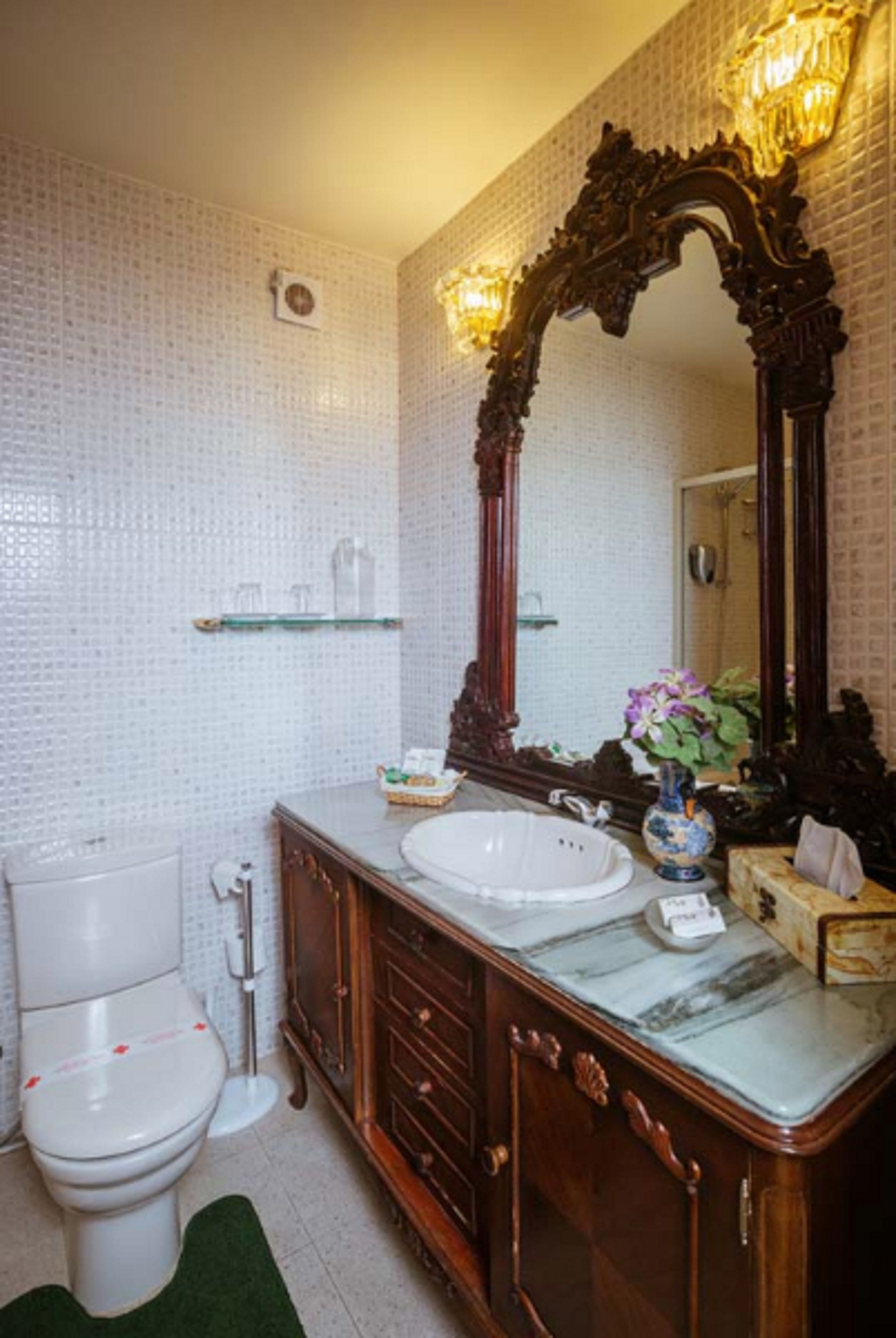 combined shower/bathtub, designer toiletries, hair dryer, bathrobes