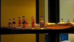 A hotel minibar with various beverages and a coffee maker. - Orient D'angkor (Siem Reap)